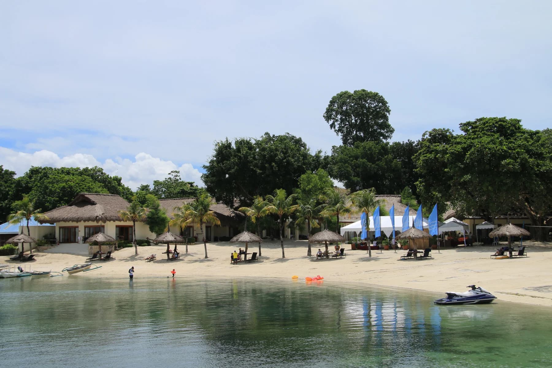 Palm-lined beach and calm water at Bluewater on Mactan Island