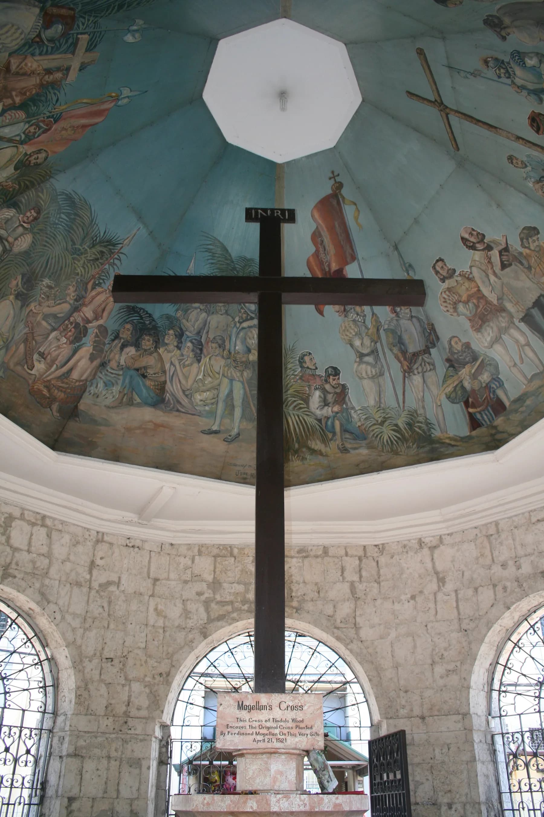 Magellan’s Cross beneath the painted ceiling of its pavilion
