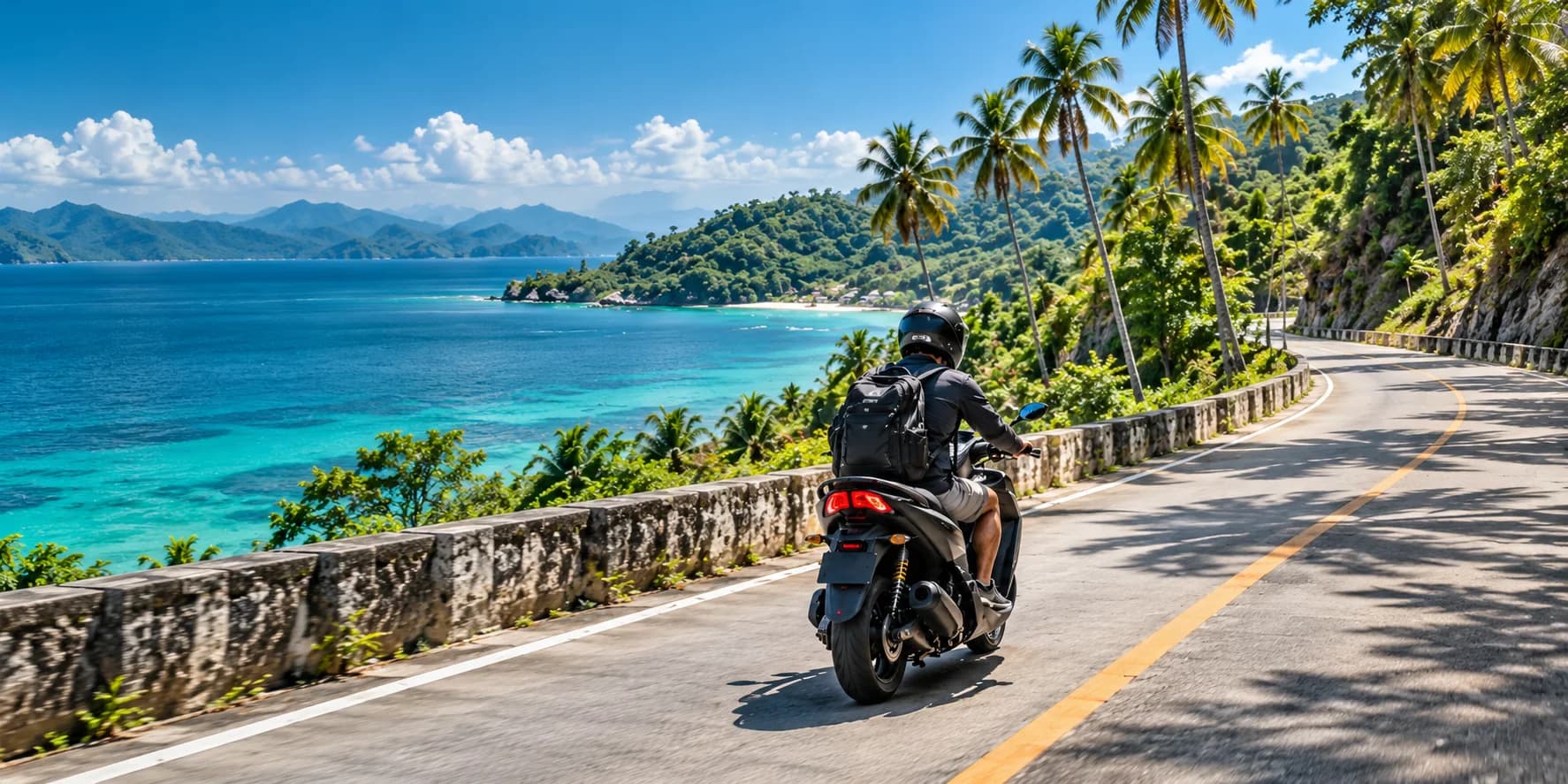 Rear view of a helmeted scooter rider exploring a tropical coastal road beside turquoise ocean and palms